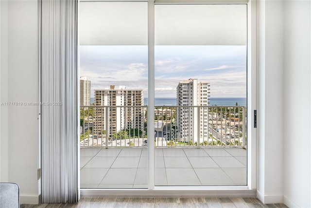 interior space with a water view and a view of city