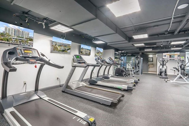 exercise room with baseboards