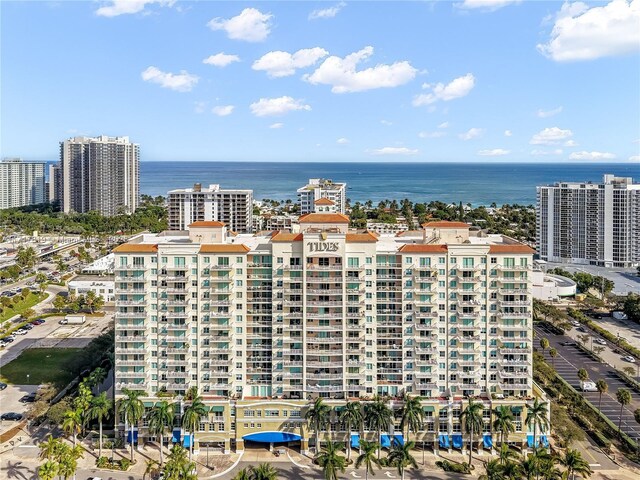 bird's eye view featuring a water view and a city view