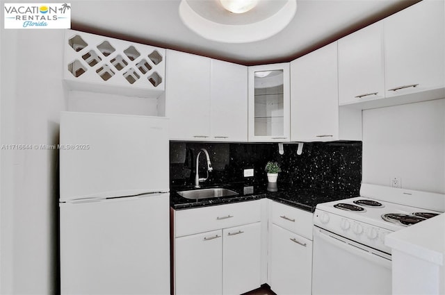 kitchen featuring backsplash, sink, white cabinets, and white appliances