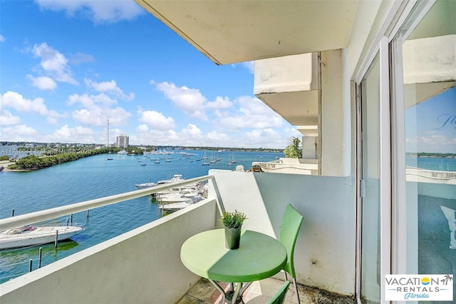 balcony featuring a water view