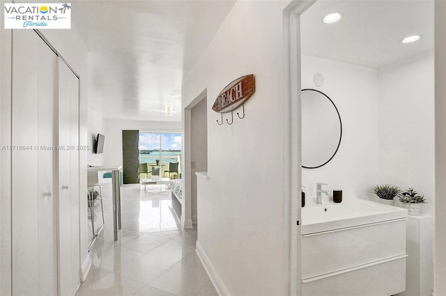 bathroom featuring tile patterned flooring and vanity