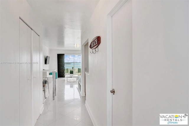 corridor featuring light tile patterned flooring