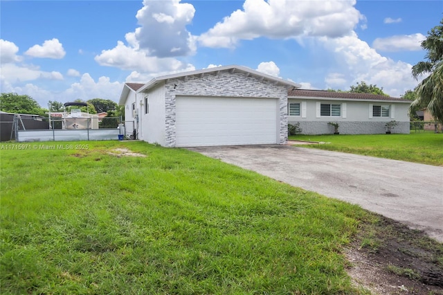 view of front facade with a front yard and a garage