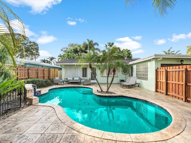 view of swimming pool featuring outdoor lounge area and a patio