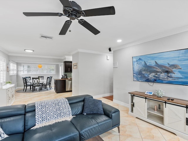 living room with ceiling fan, light tile patterned flooring, and ornamental molding