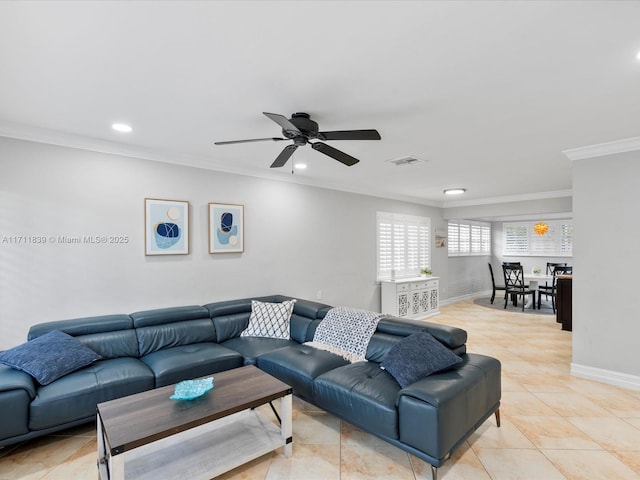 living room featuring ceiling fan, light tile patterned floors, and ornamental molding