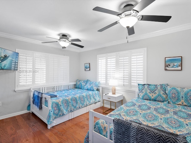 bedroom with ceiling fan, hardwood / wood-style floors, and ornamental molding