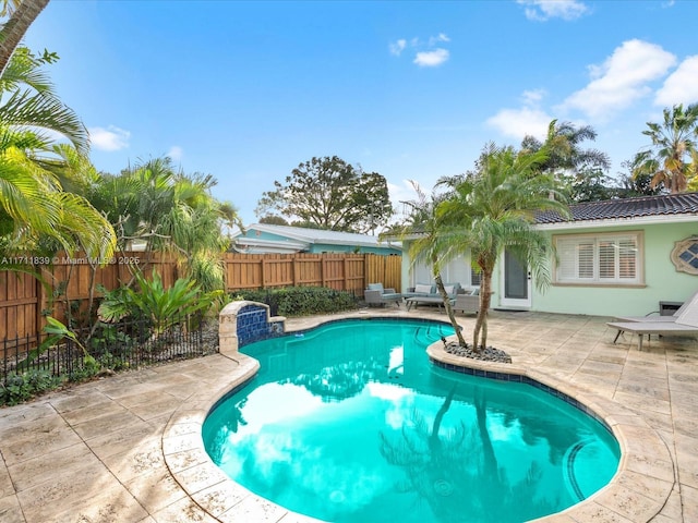 view of pool featuring a patio