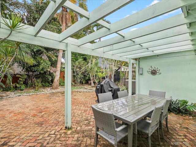 view of patio with a pergola and a grill