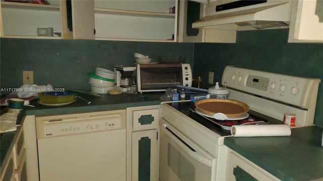 kitchen featuring extractor fan and white appliances