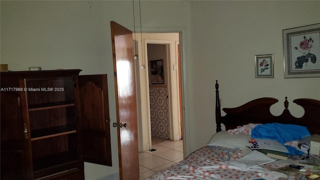 bedroom featuring light tile patterned floors