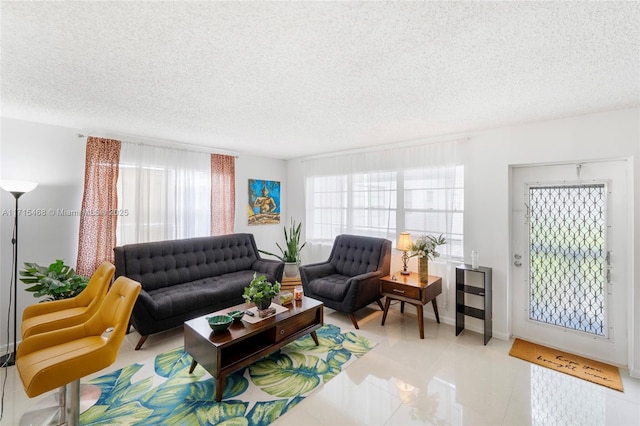 tiled living room with a textured ceiling