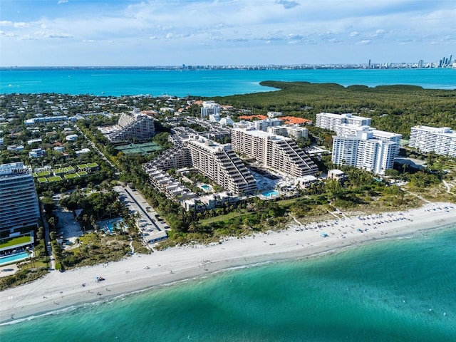 drone / aerial view featuring a view of the beach and a water view