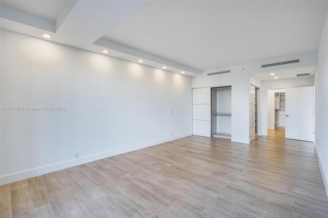 unfurnished room featuring light hardwood / wood-style flooring