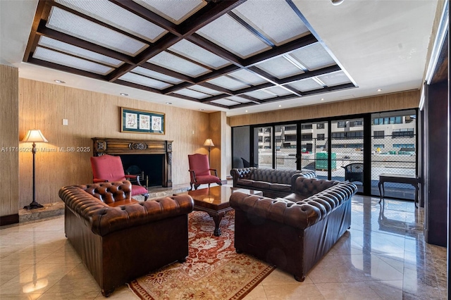 living room with beamed ceiling, coffered ceiling, and wood walls