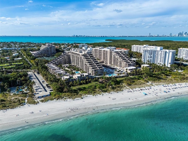 bird's eye view with a view of the beach and a water view