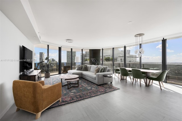 living room featuring floor to ceiling windows and a healthy amount of sunlight