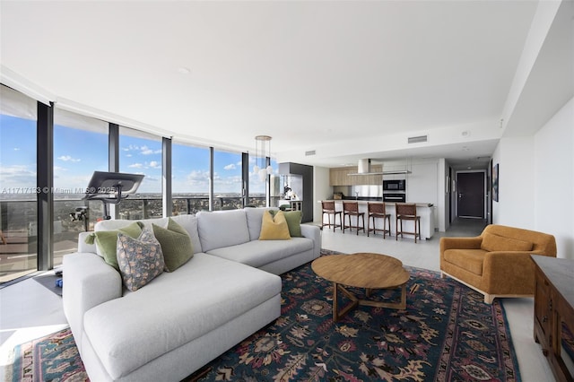 living room featuring floor to ceiling windows