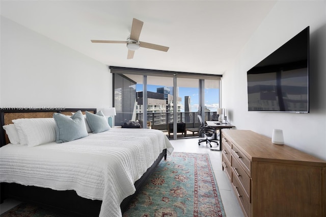 bedroom featuring access to exterior, expansive windows, and ceiling fan