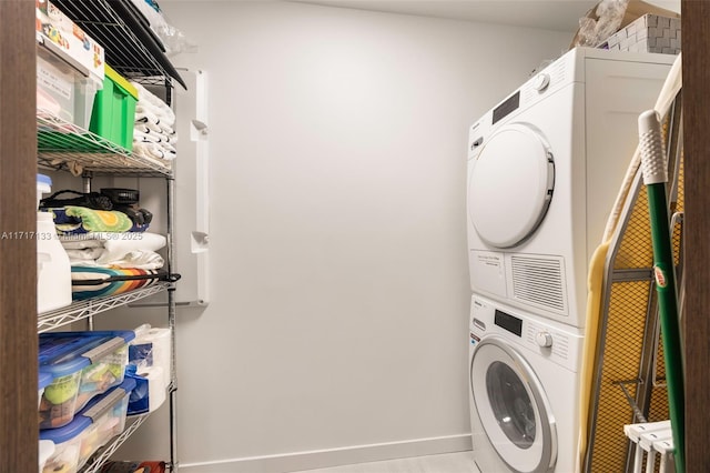 laundry area featuring stacked washer and dryer