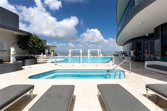 view of swimming pool with a patio area