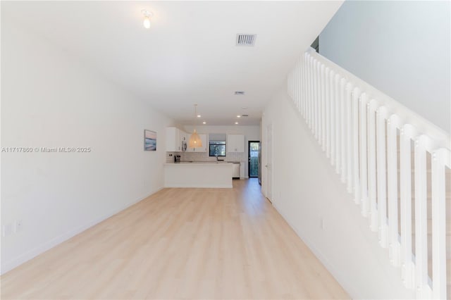 hall featuring light wood-type flooring