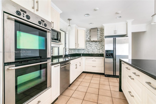 kitchen with stainless steel appliances, sink, pendant lighting, white cabinetry, and light tile patterned flooring