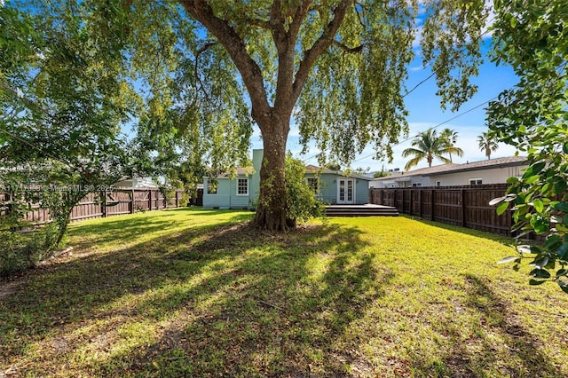 view of yard with a wooden deck