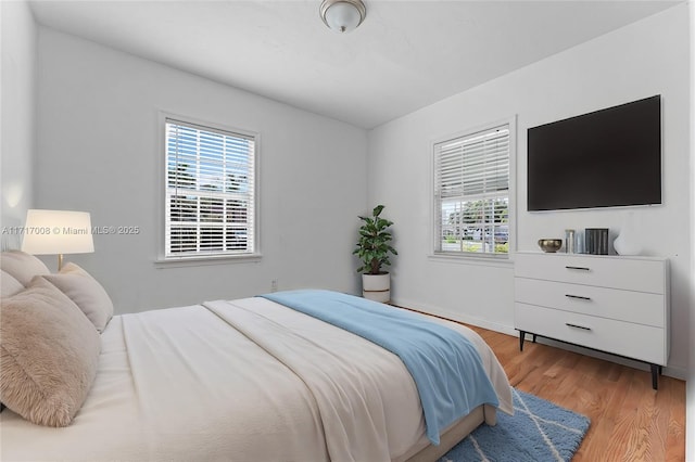 bedroom with light wood-type flooring