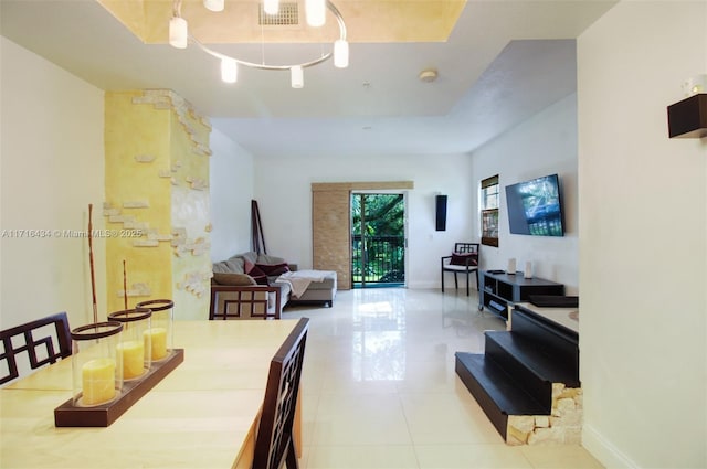 dining area featuring light tile patterned flooring