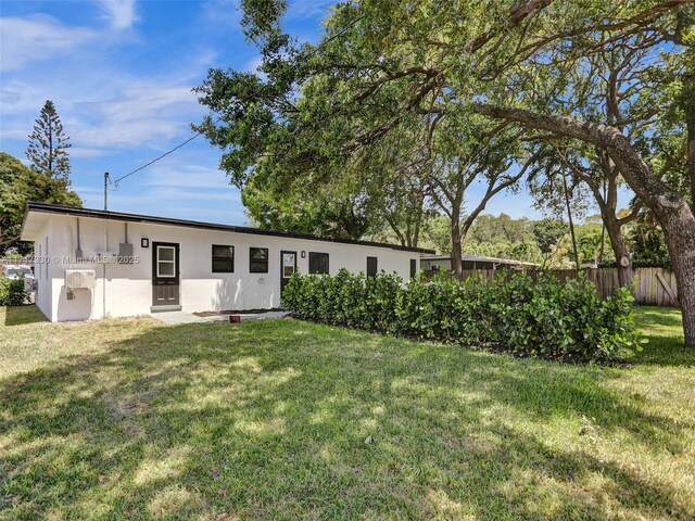 exterior space with a front lawn