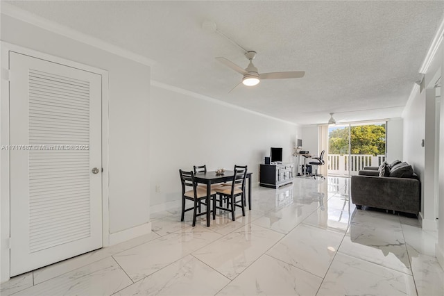 dining space with ceiling fan, a textured ceiling, and ornamental molding