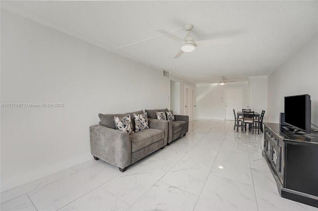 living room featuring ceiling fan and ornamental molding