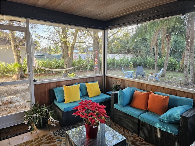 sunroom / solarium featuring wood ceiling