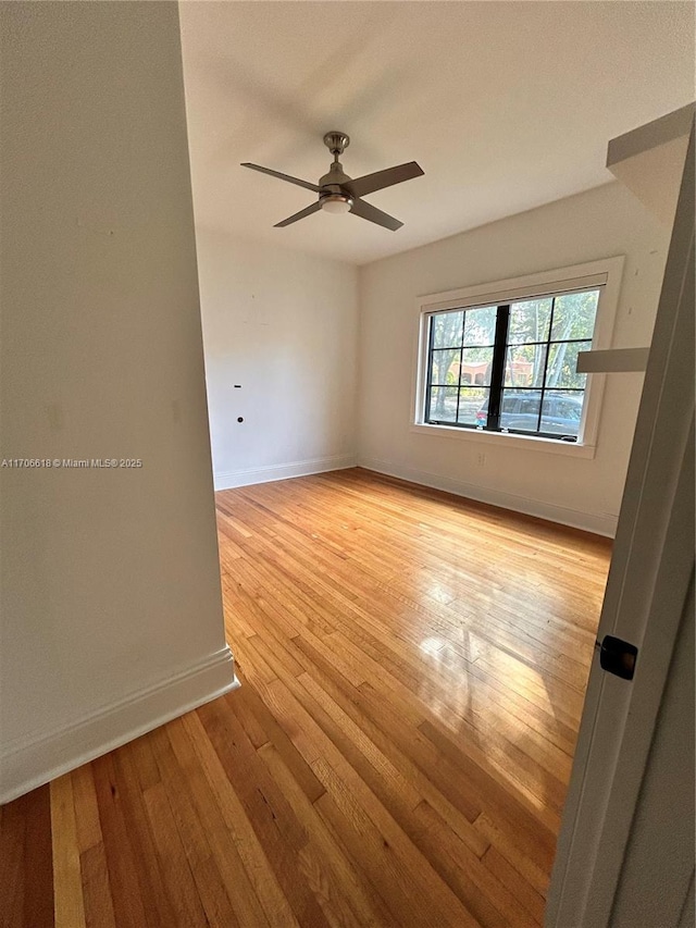 unfurnished room featuring ceiling fan and light hardwood / wood-style floors