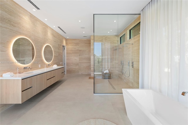 bathroom with plus walk in shower and vanity
