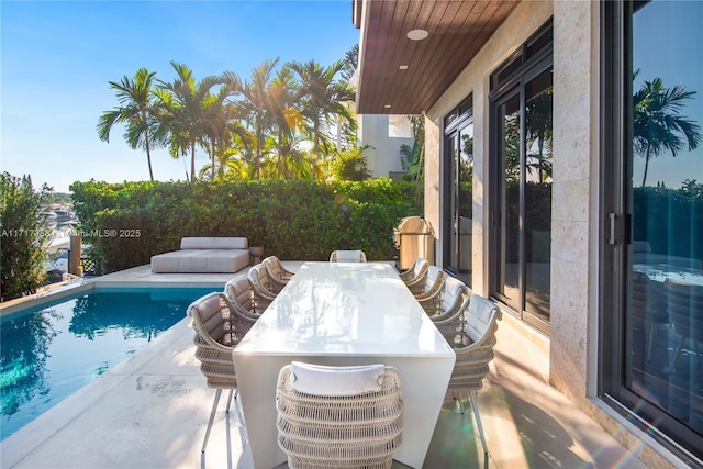 view of swimming pool featuring a patio