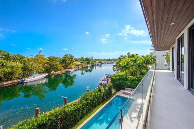 view of swimming pool featuring a water view