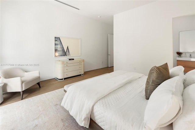 bedroom featuring light wood-type flooring