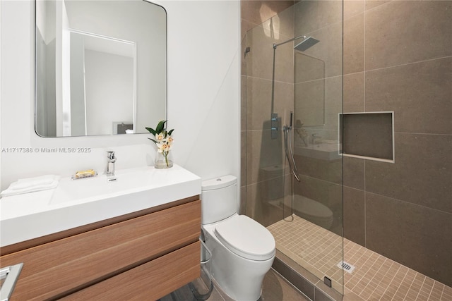 bathroom featuring vanity, toilet, and walk in shower