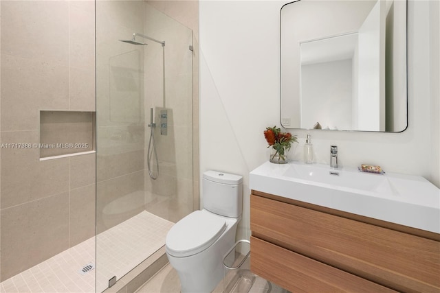 bathroom with vanity, an enclosed shower, and toilet