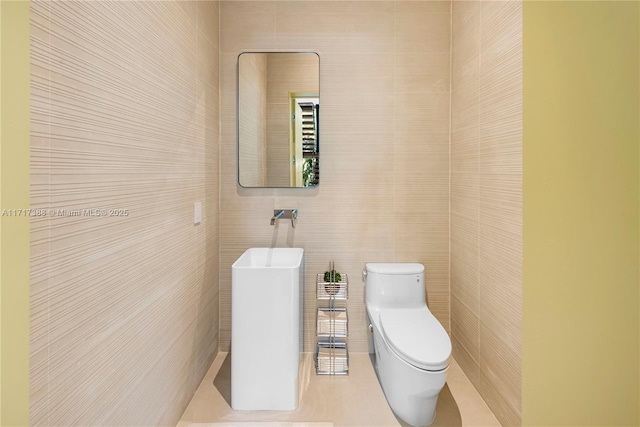 bathroom featuring tile patterned floors and toilet