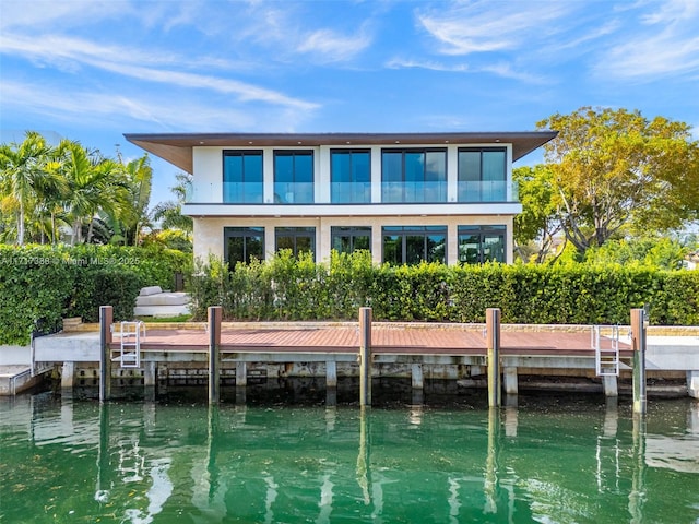 back of house featuring a water view