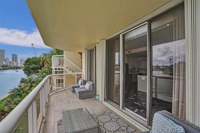 balcony featuring a water view