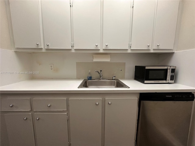 kitchen featuring white cabinetry, sink, and stainless steel appliances