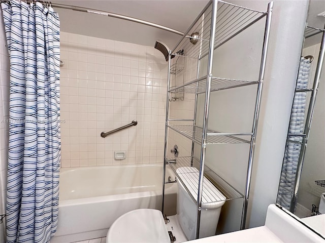 bathroom featuring shower / bath combo with shower curtain and toilet