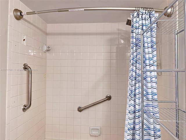 bathroom with a tile shower