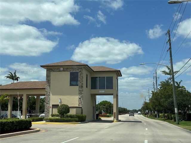 151 SW 135th Ter Unit 106T, Pembroke Pines, FL 33027 - view of road with street lighting and curbs