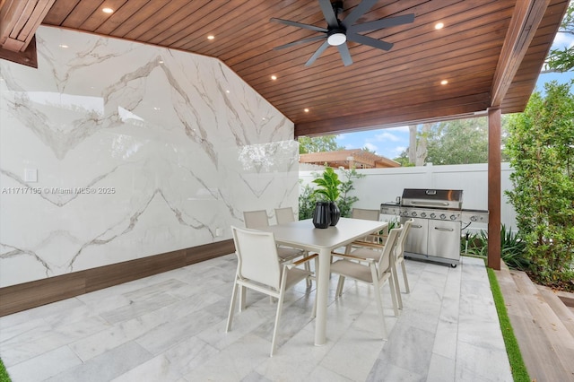 view of patio / terrace with a ceiling fan, outdoor dining area, fence, and grilling area